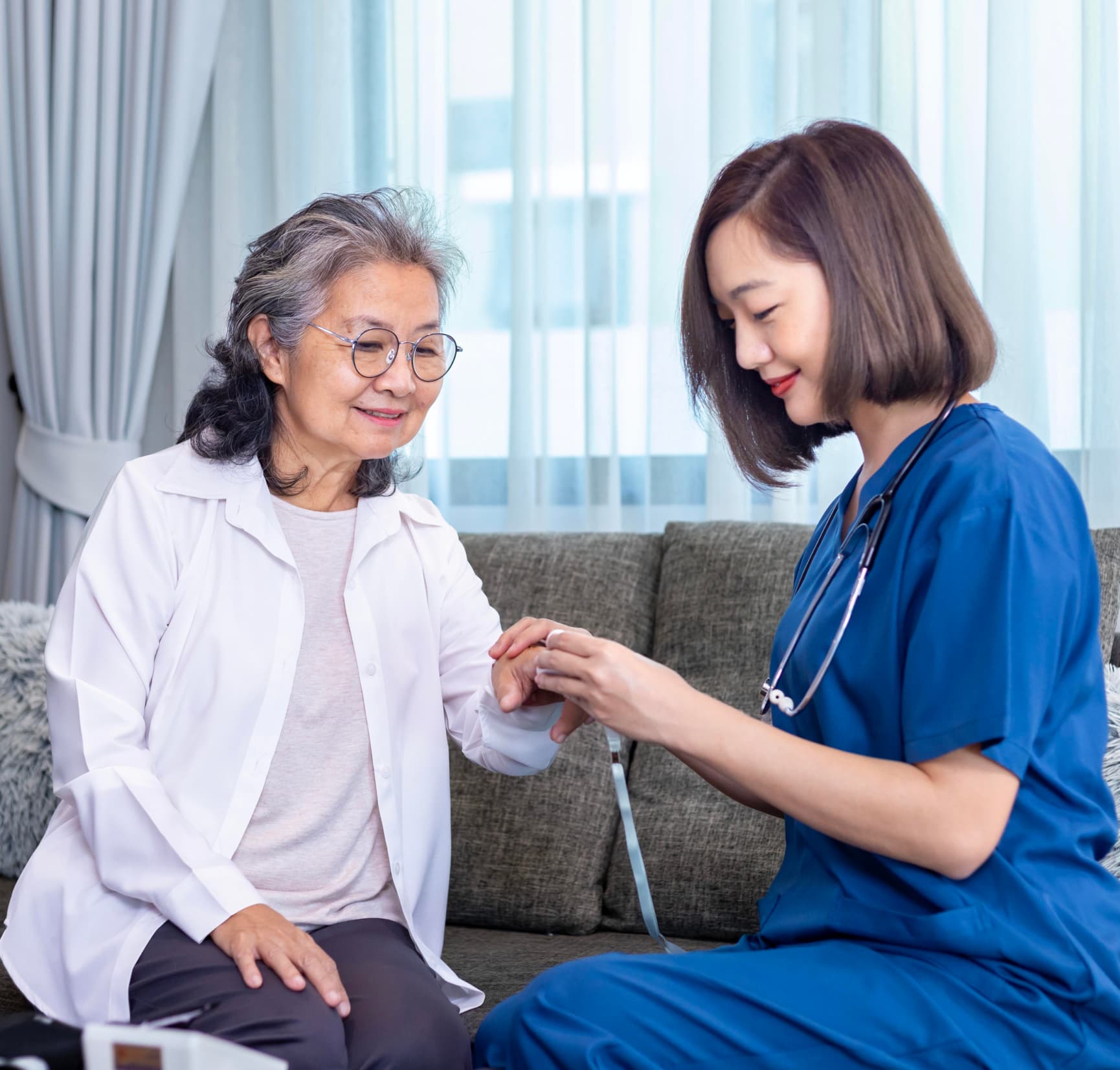 A nurse caring for an elderly woman