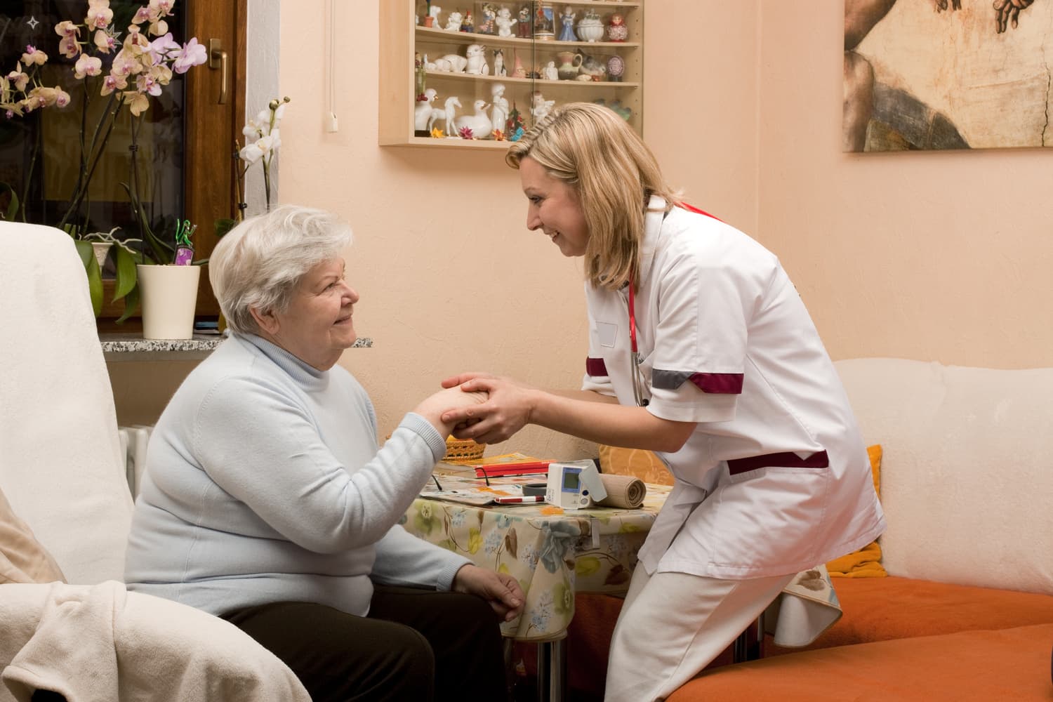 A doctor treating a patient in her NYC home.