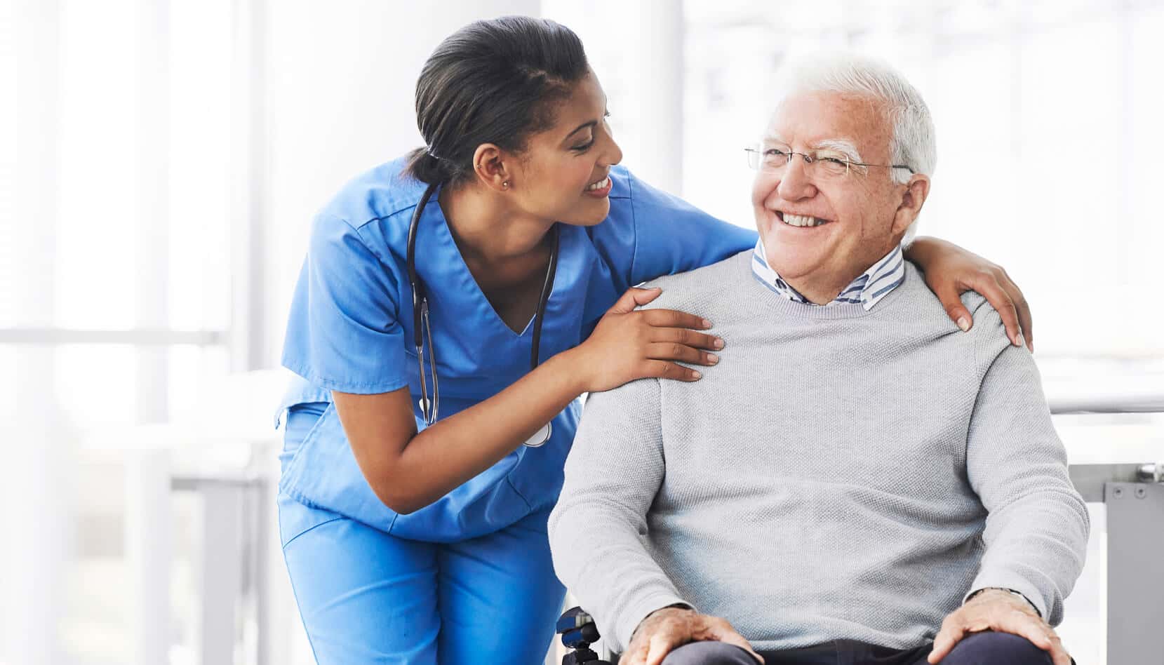 A nurse and a senior on wheelchair