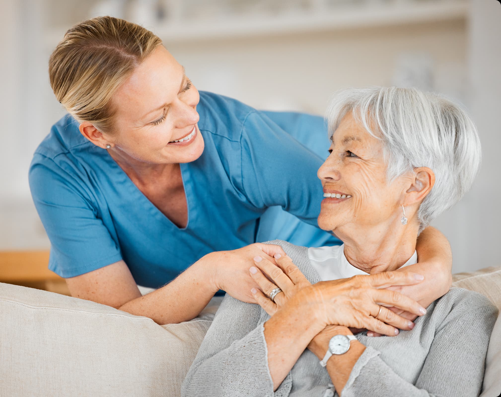 A nurse caring for an elderly patient at home