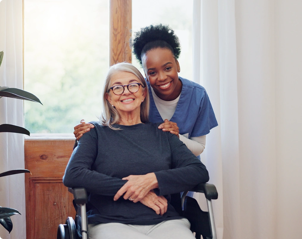 An elderly woman and her caregiver
