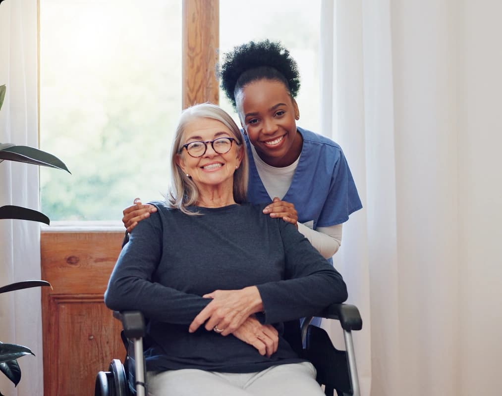 An elderly woman and her caregiver