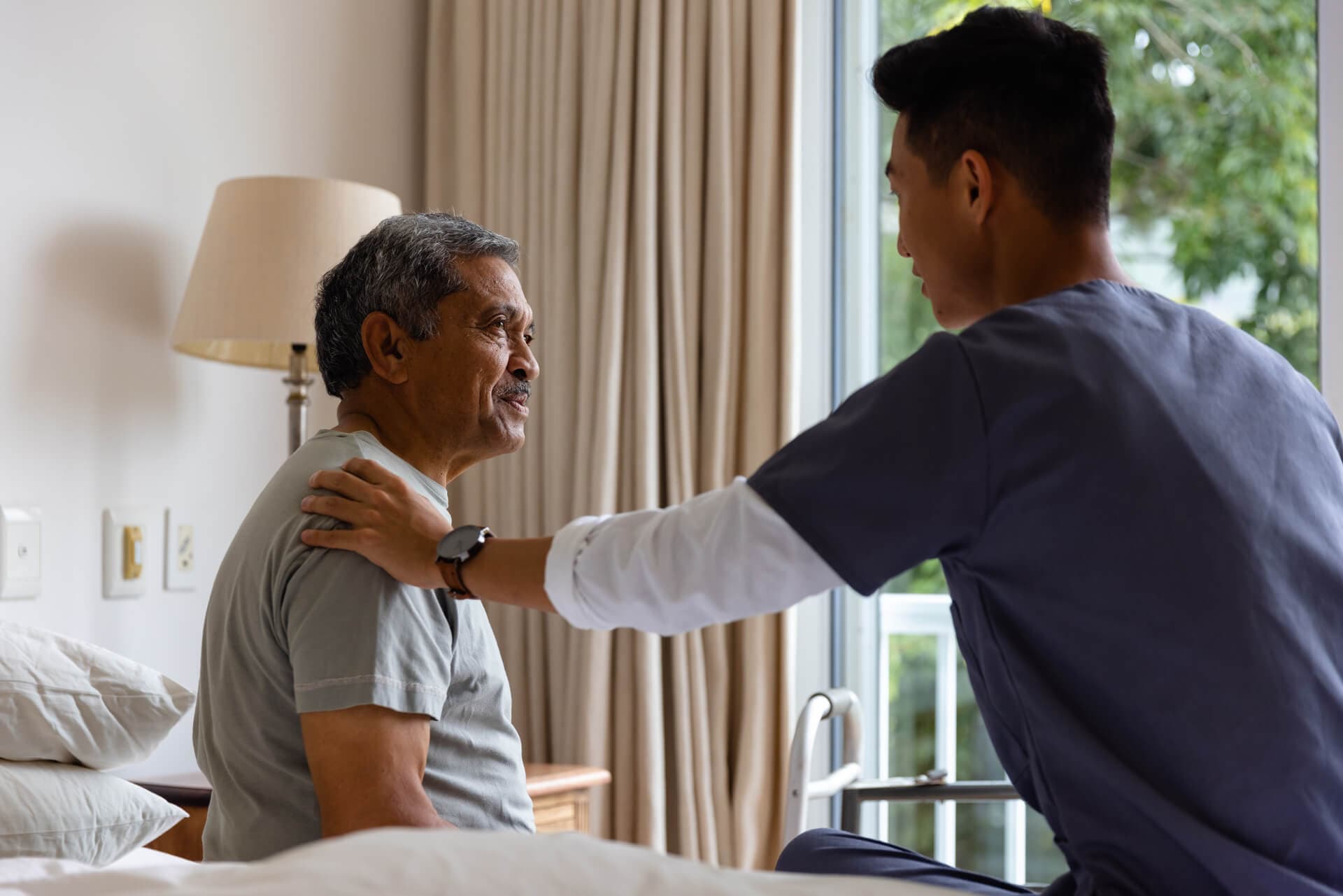 A patient smiling with a nurse