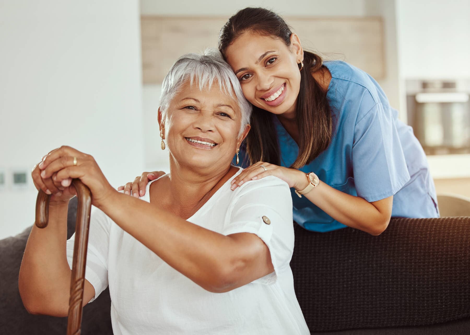 A smiling patient and caregiver