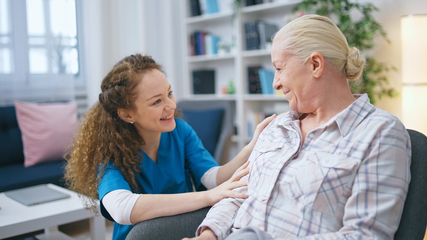 A visiting physician caring for an elderly patient in her NYC home.