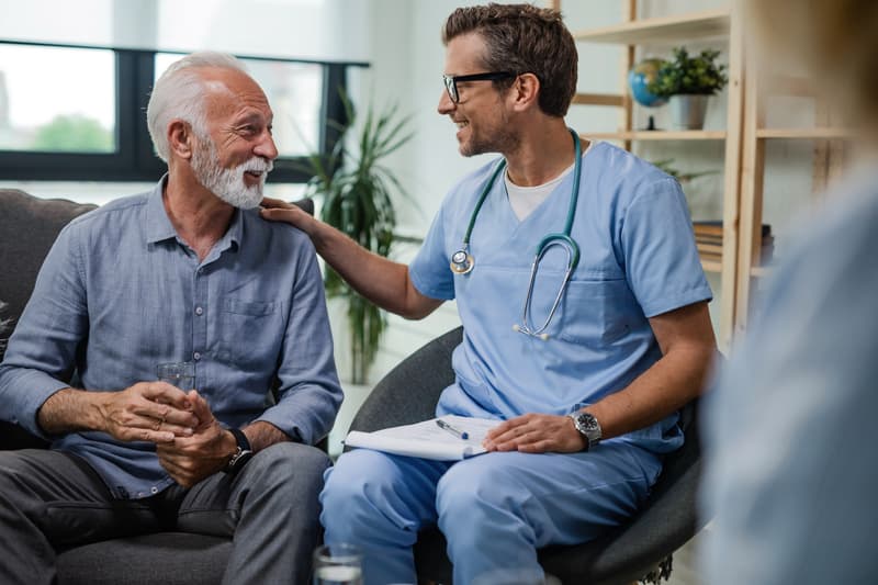 A visiting physician with an elderly patient at his NYC home.